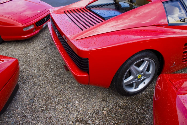 two red cars parked close to each other