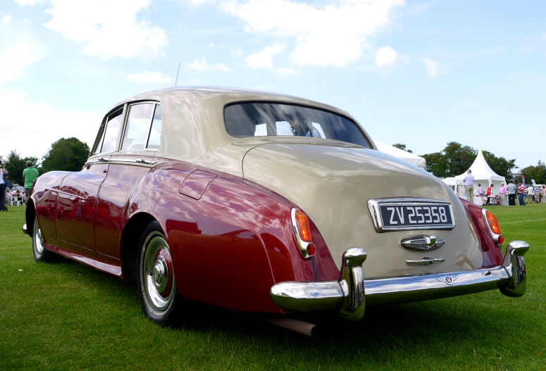 classic car at a car show in the grass