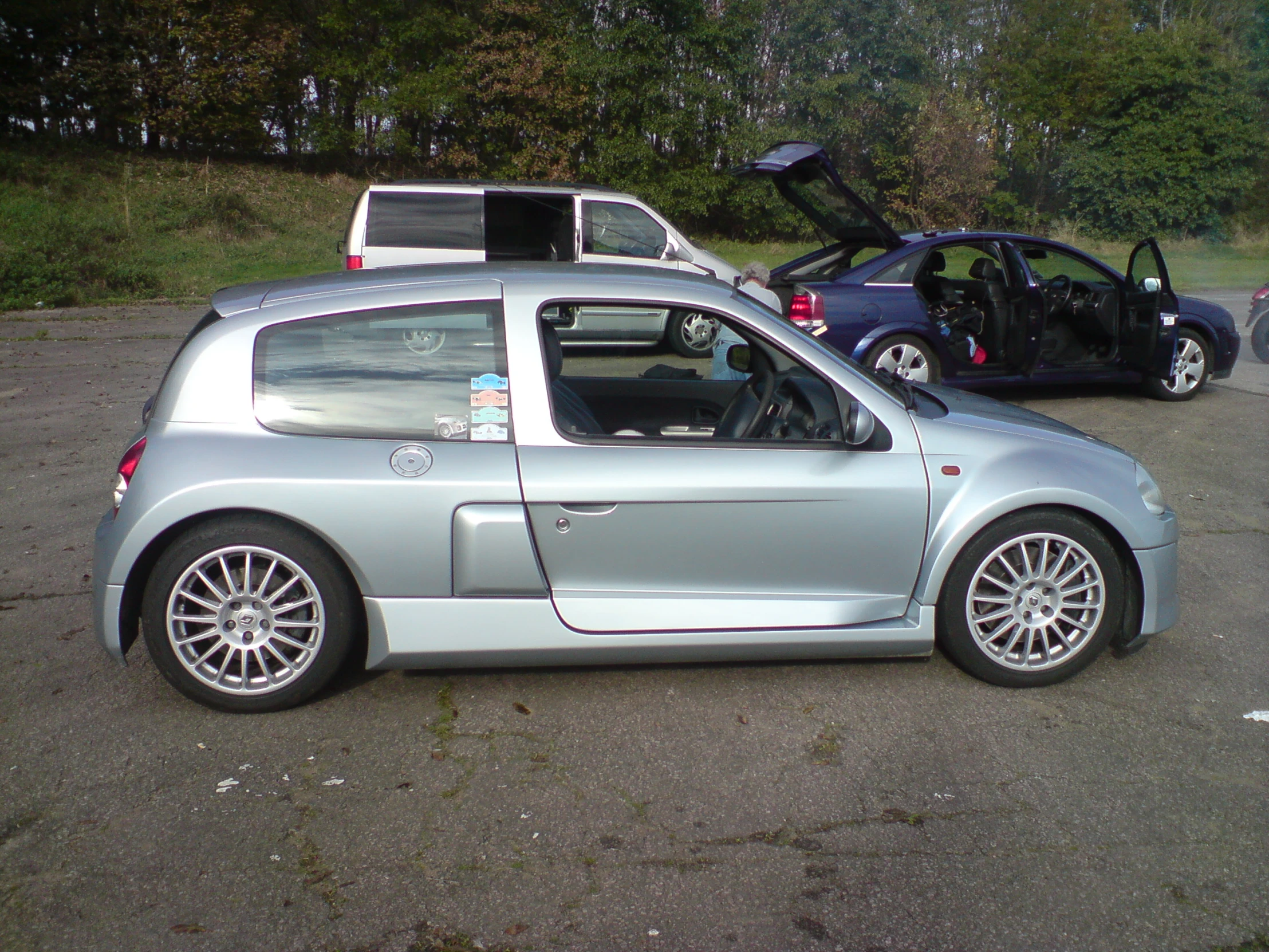 the back end of a silver car is shown