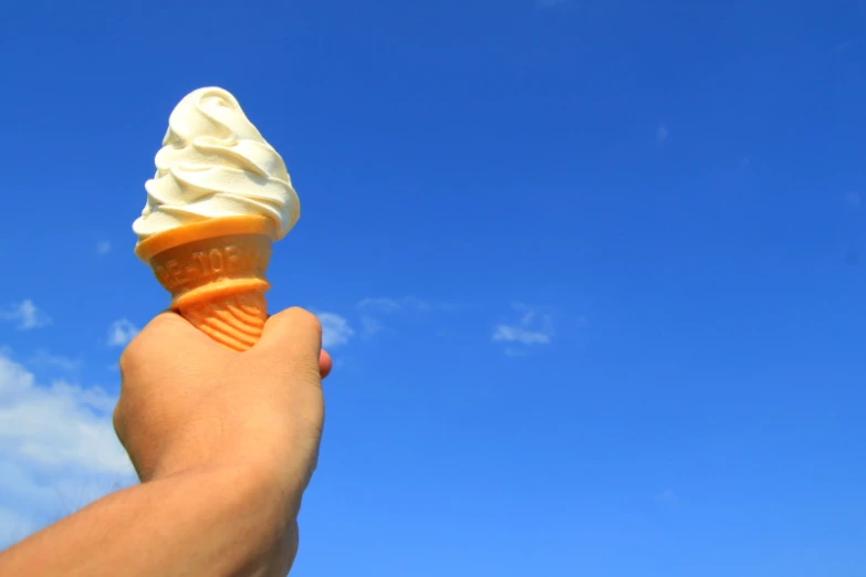 an ice cream cone with some kind of orange substance