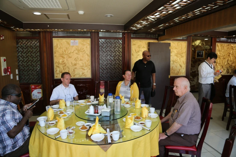 the family is enjoying a meal together in the restaurant