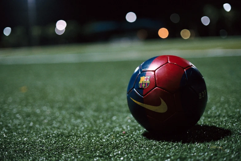 a soccer ball sitting on a grass field