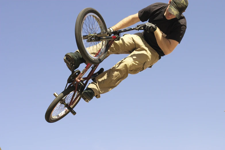 a man jumping with a bike in the air