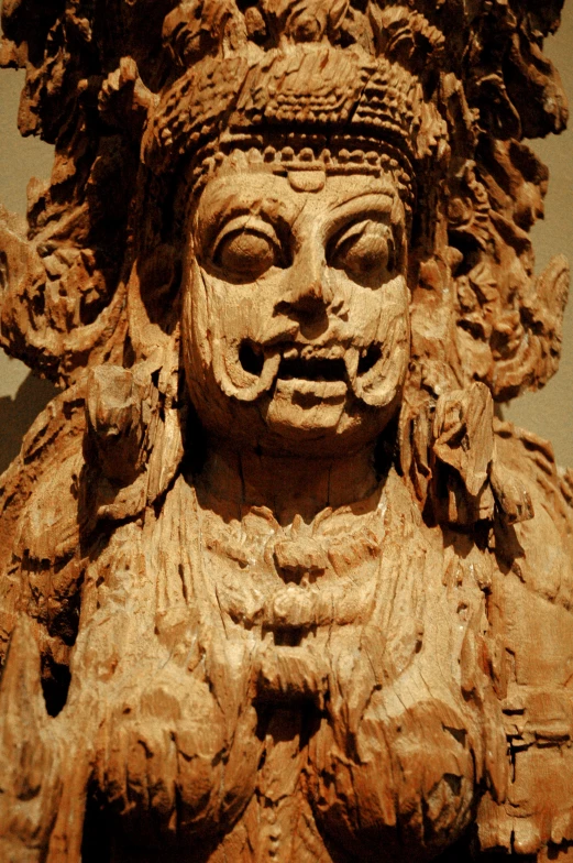 an ancient carving of a man with long hair