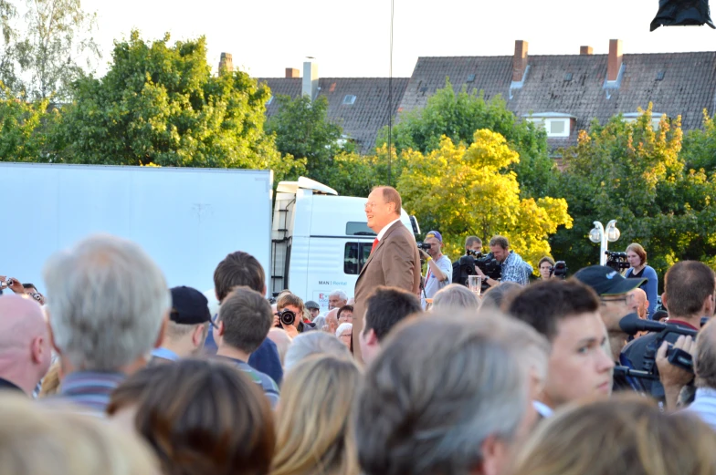 a man standing in front of a crowd of people