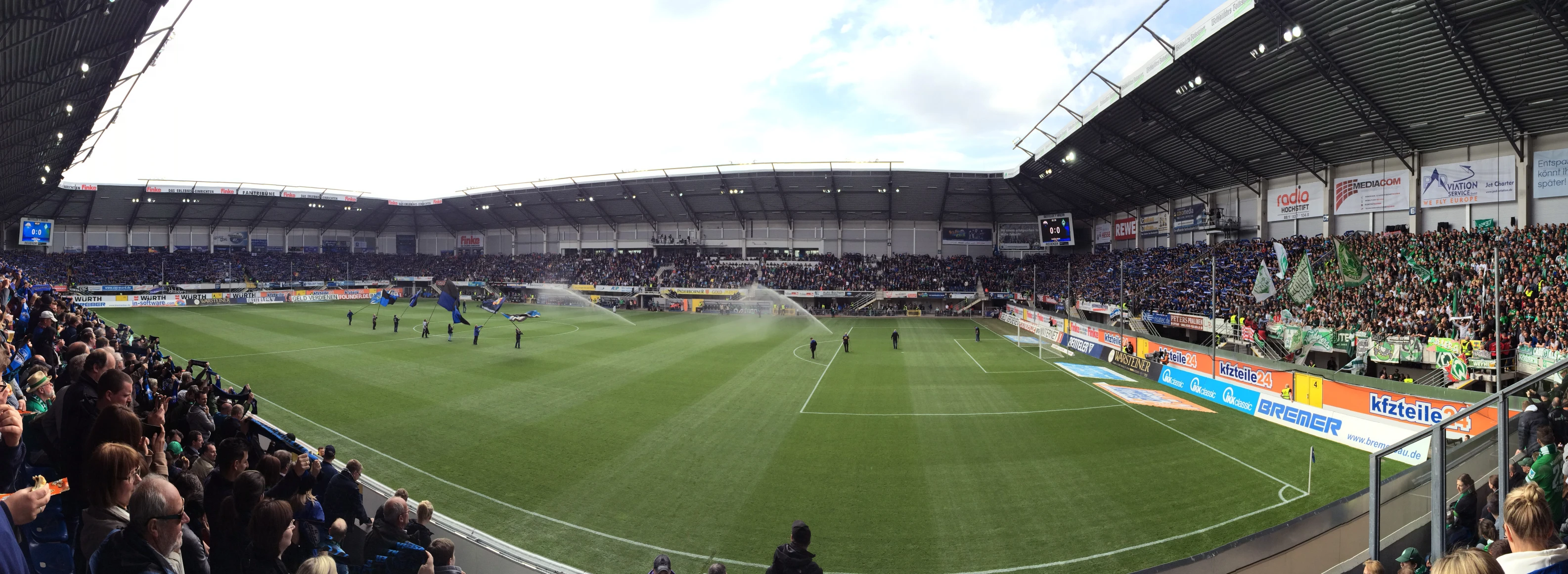 a crowd of people watching a soccer game