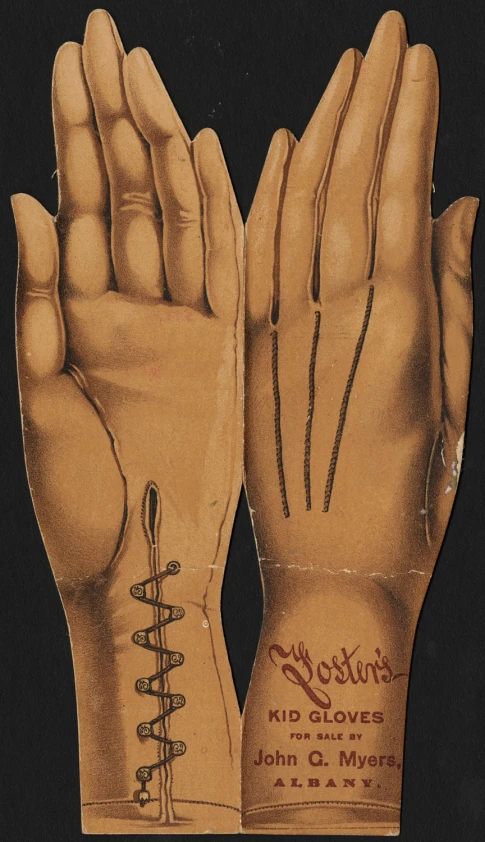 a pair of vintage gloves with one open