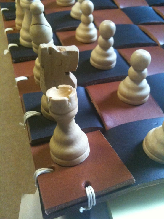 chess pieces that are brown, blue and white