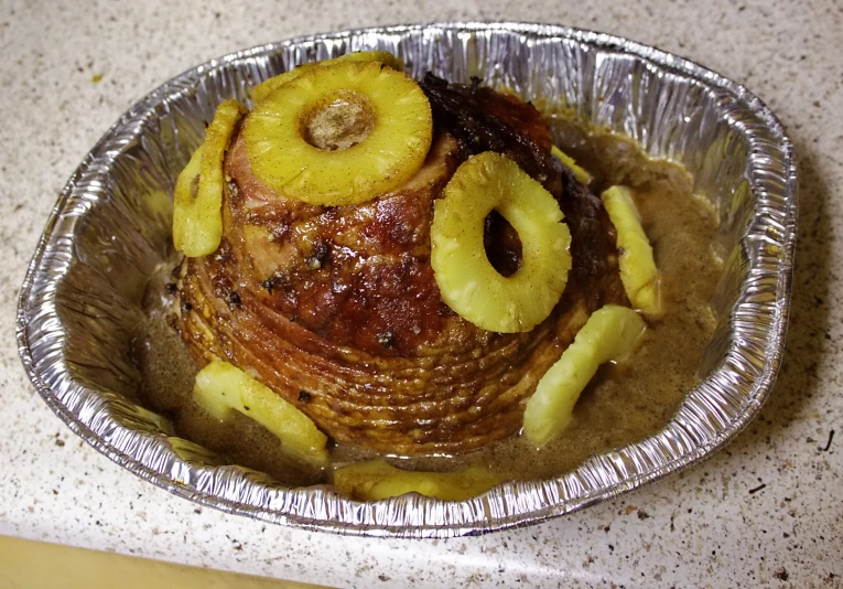 pancakes covered in caramelized bananas and sliced bananas