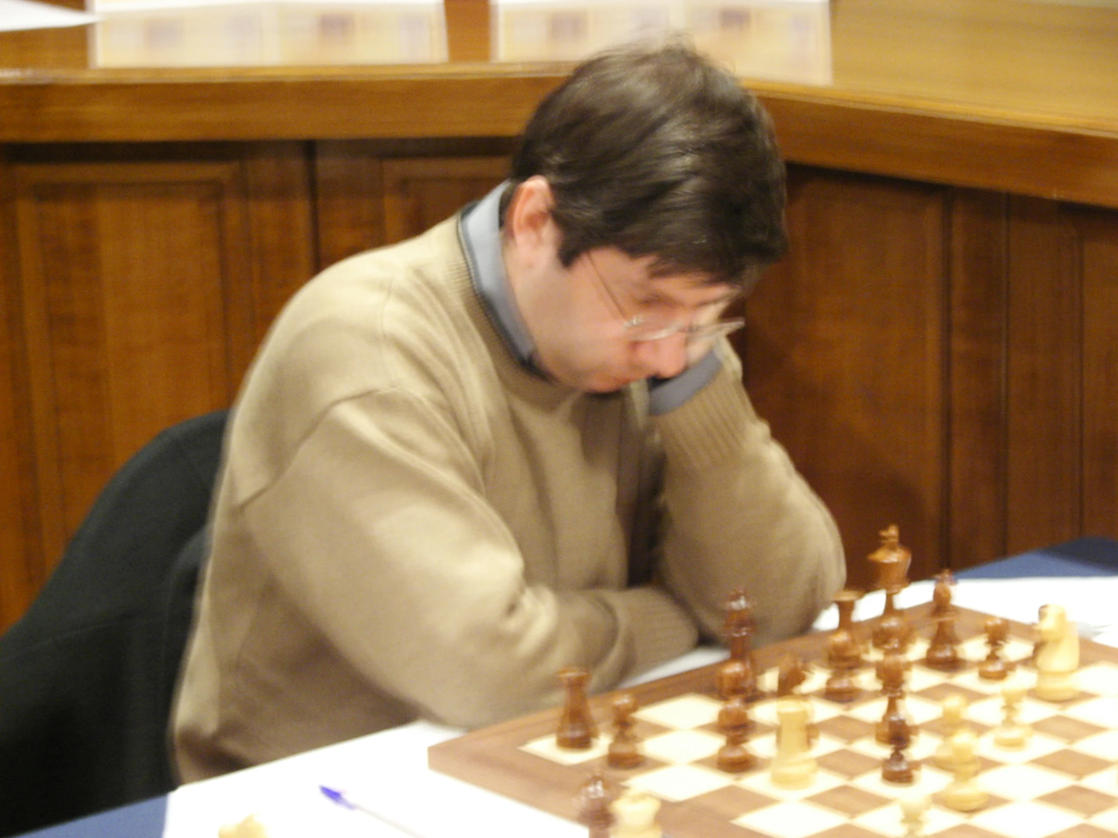 man in the middle of playing chess