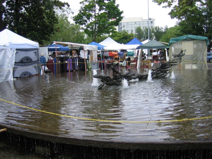 a large crowd of people are gathered in the rain