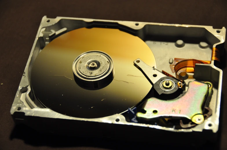 a closed up hard drive with metal latch