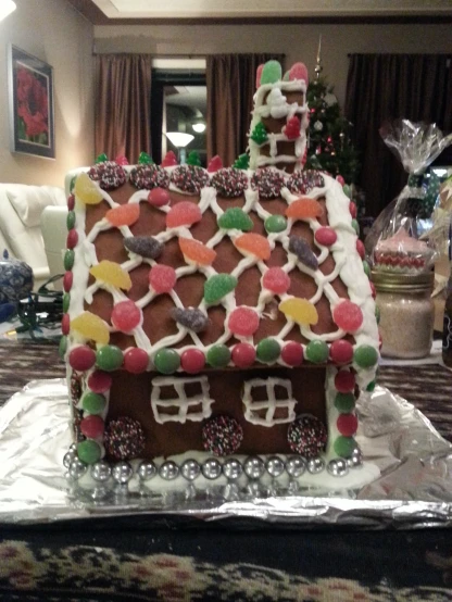 a close up of a cake shaped like a house