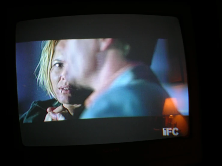 a television screen showing a close up s of two women on one side