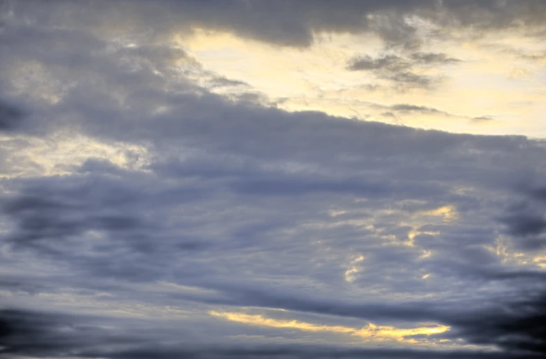 this is a view from the ocean with clouds