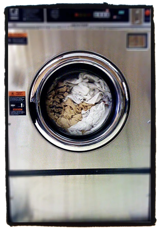 a washer with some dirty laundry in it