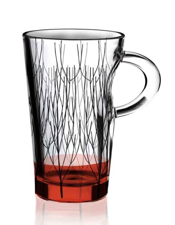 a glass cup of red colored liquid