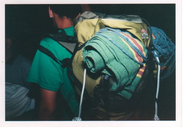 the back of a backpack with strings attached to it