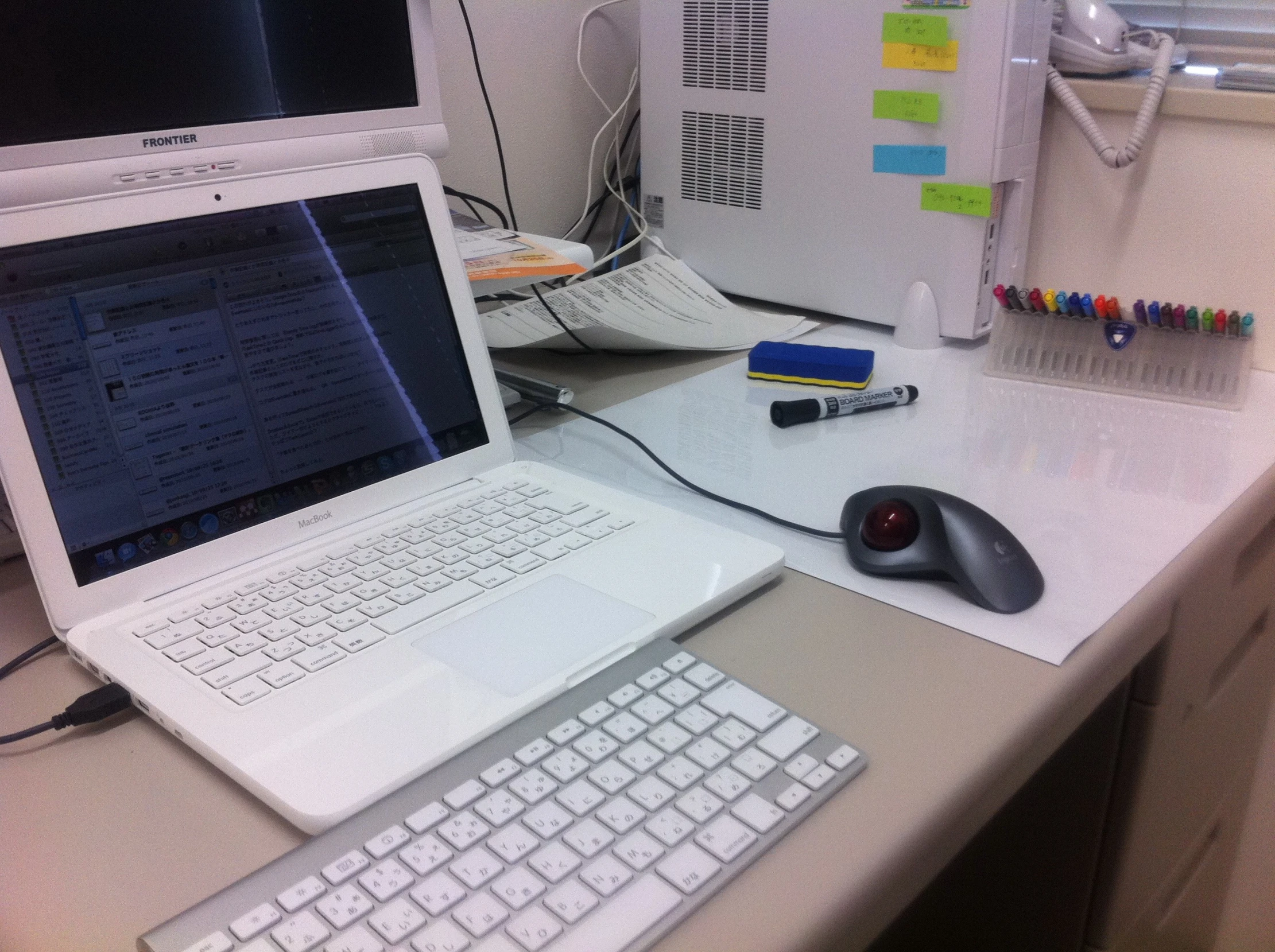 two computers that are on a desk