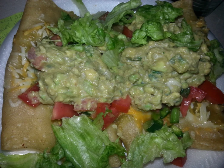 two plates filled with food and dressing on them