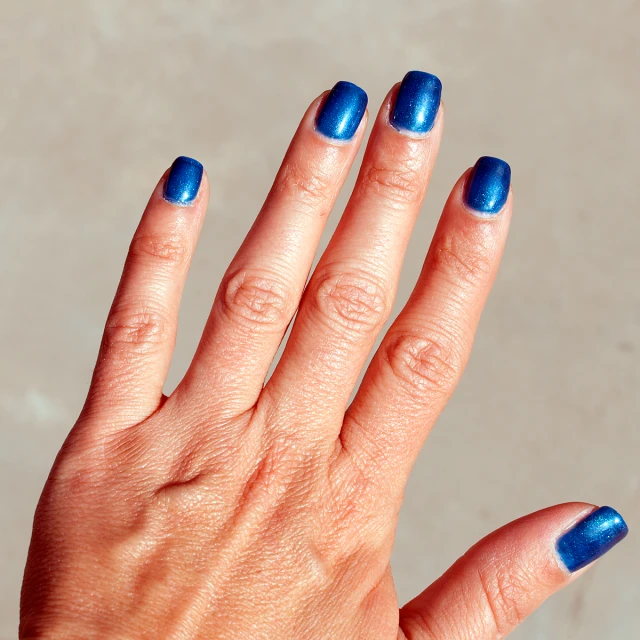 blue manicure with dark green tips