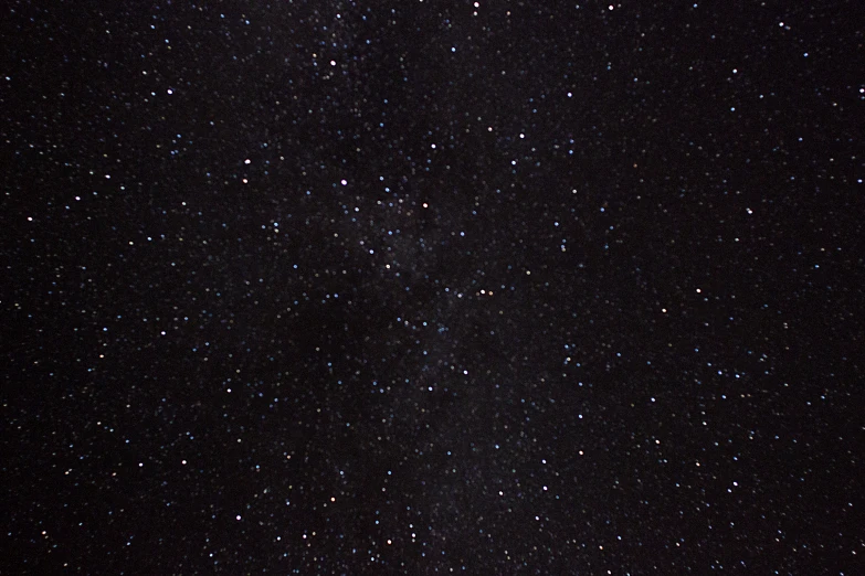 stars against a dark night sky full of small dots