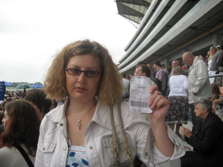 a women is holding a paper in front of her