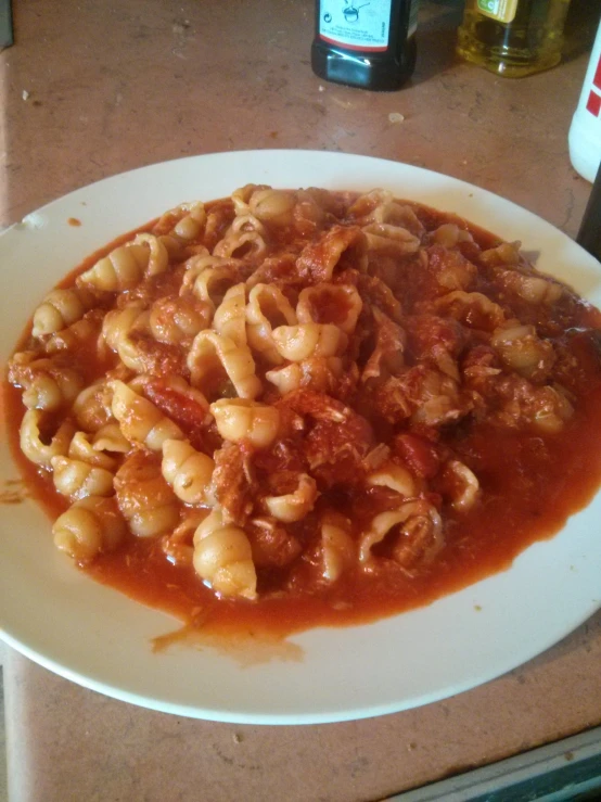 a plate with some pasta on a table