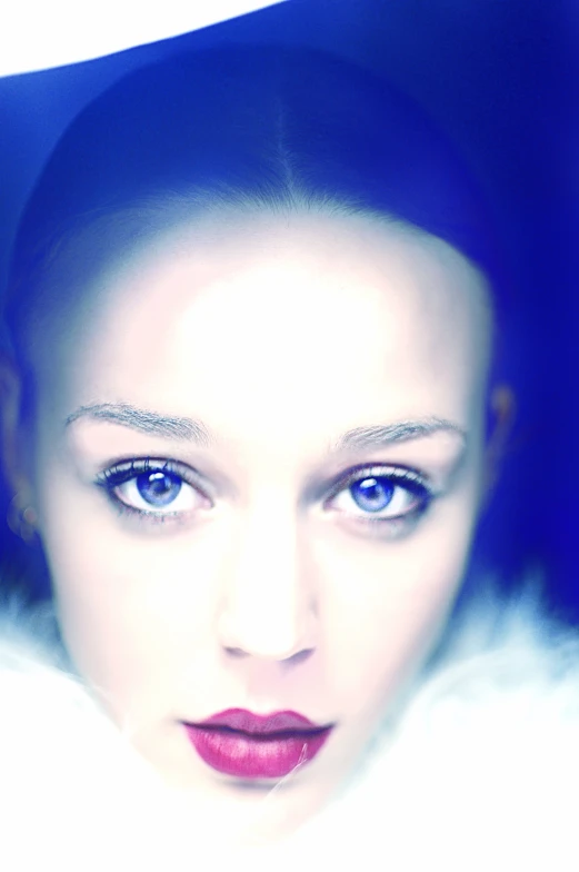 this is a woman with blue eyes and red lips