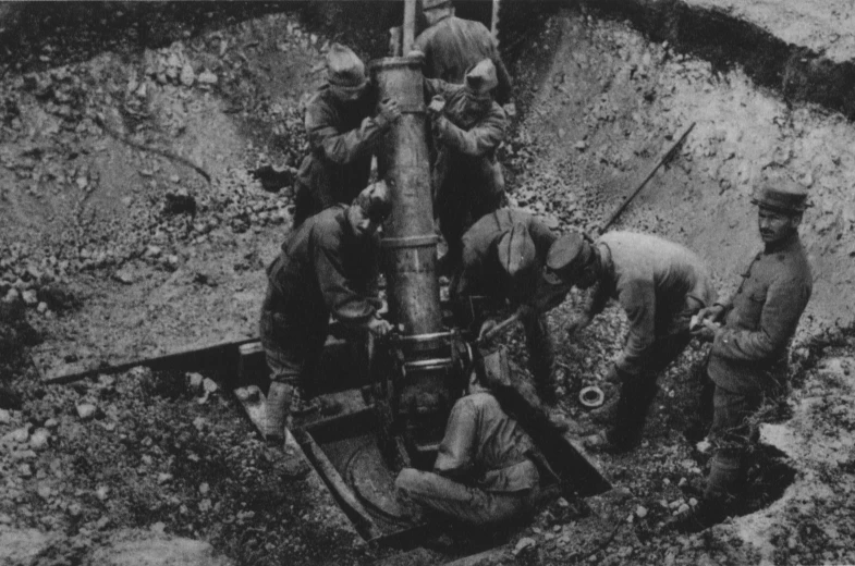 men digging through trench in vintage po