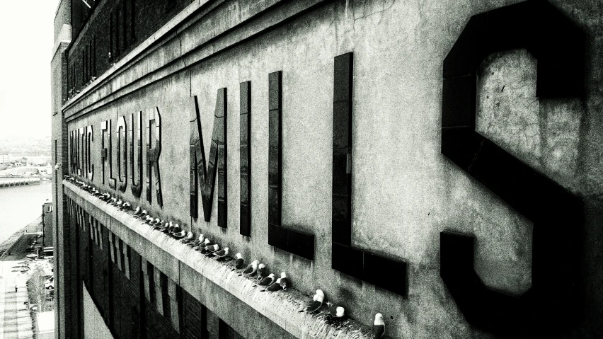 black and white image of a building with letters on it