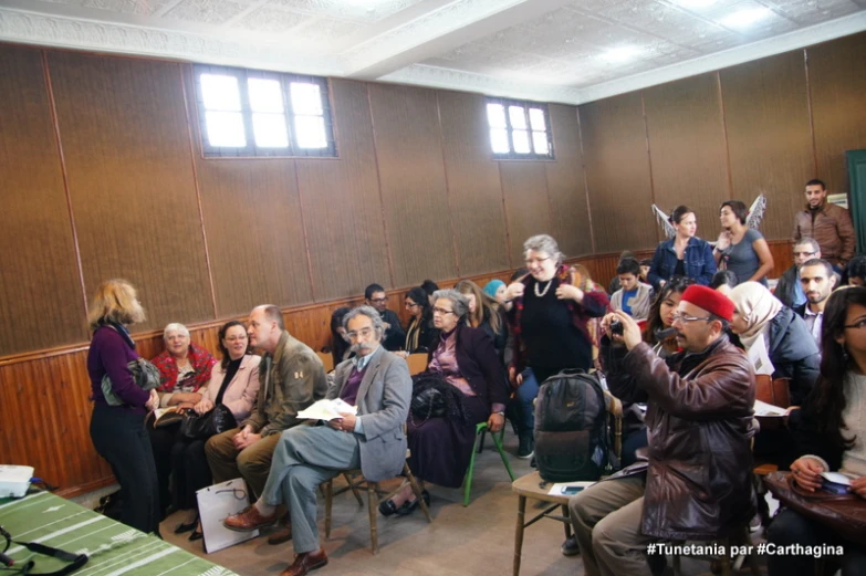 a group of people sitting in a room