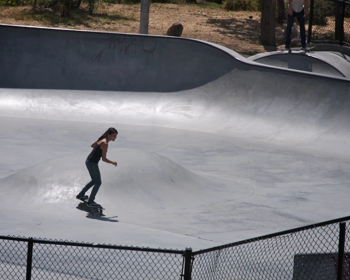  on skateboard at outdoor skate park