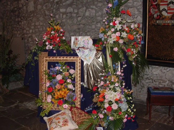 a shrine with floral arrangements and decorations