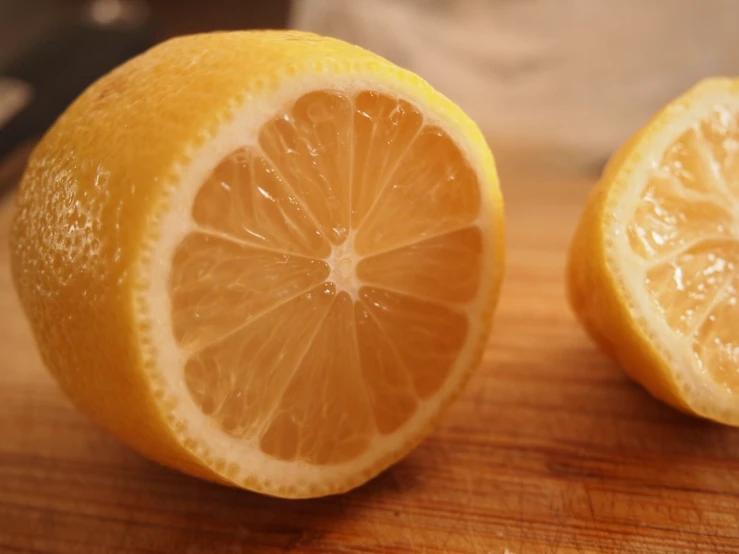 a lemon is shown with the top cut open