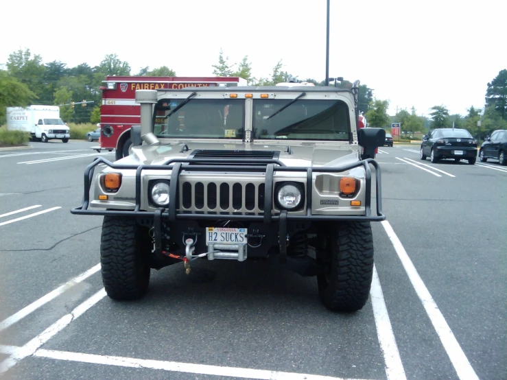 a hummer is parked in a parking lot