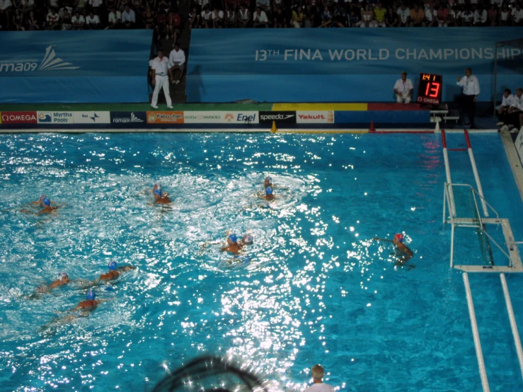 swimmers in the middle of a swimming pool