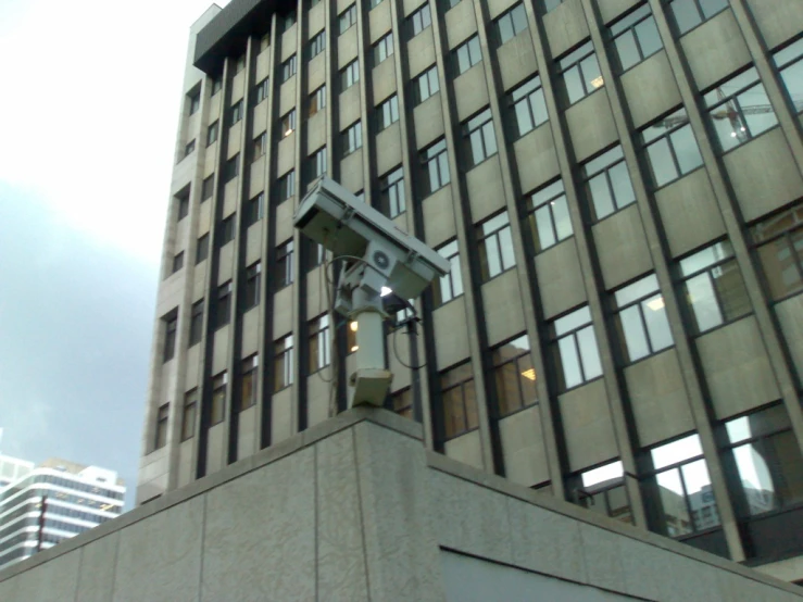 the building is gray and tall with windows