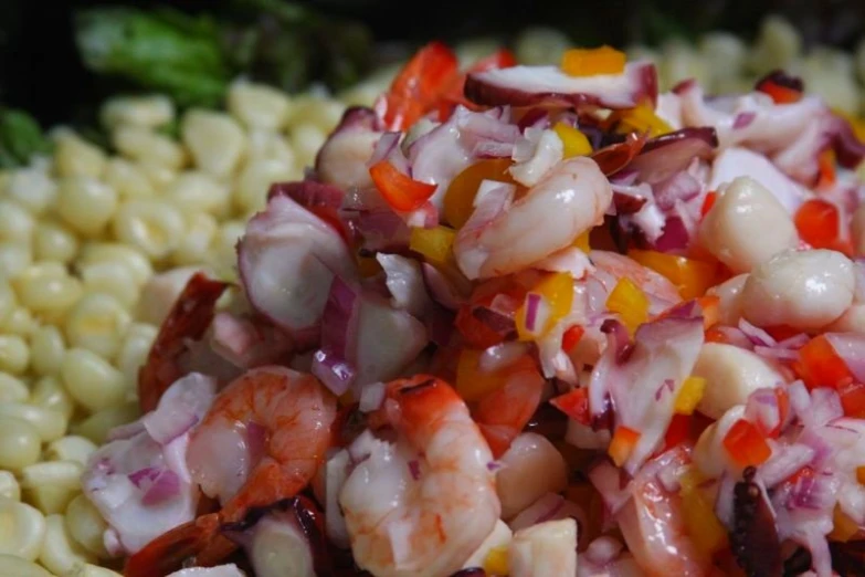 a close up view of some food that includes beans and vegetables