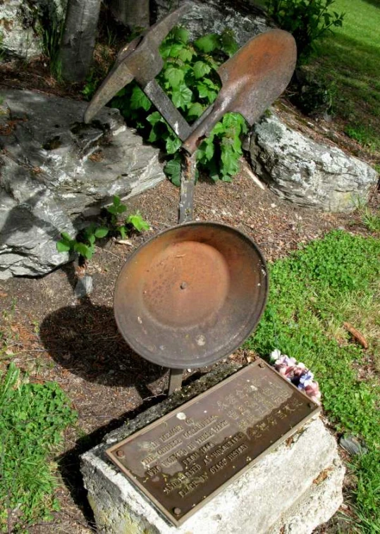 a metal bowl sitting on top of a cement block