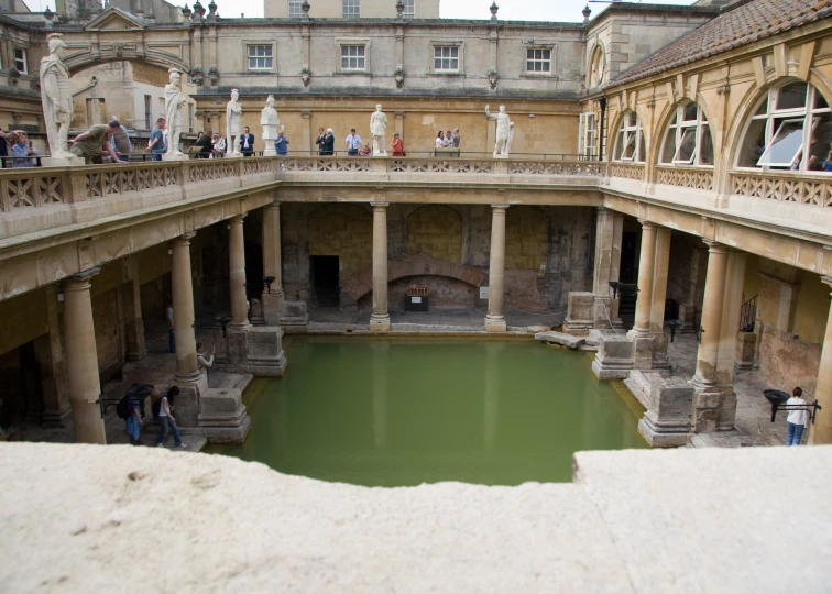 the inside of a building with a pool in the center