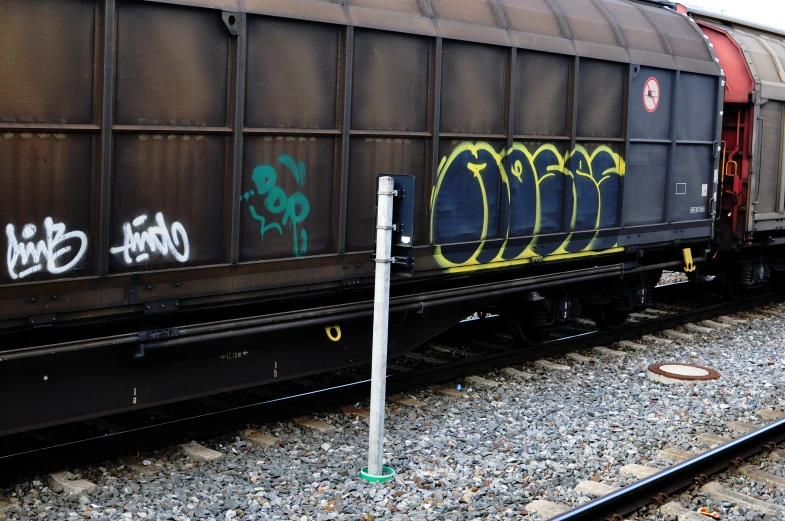 a train car with some graffitti written on it