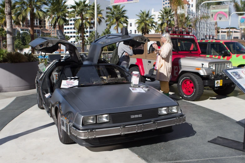 an older car with some strange accessories parked in front of it