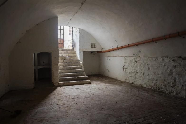 a hallway with some stairs leading to it