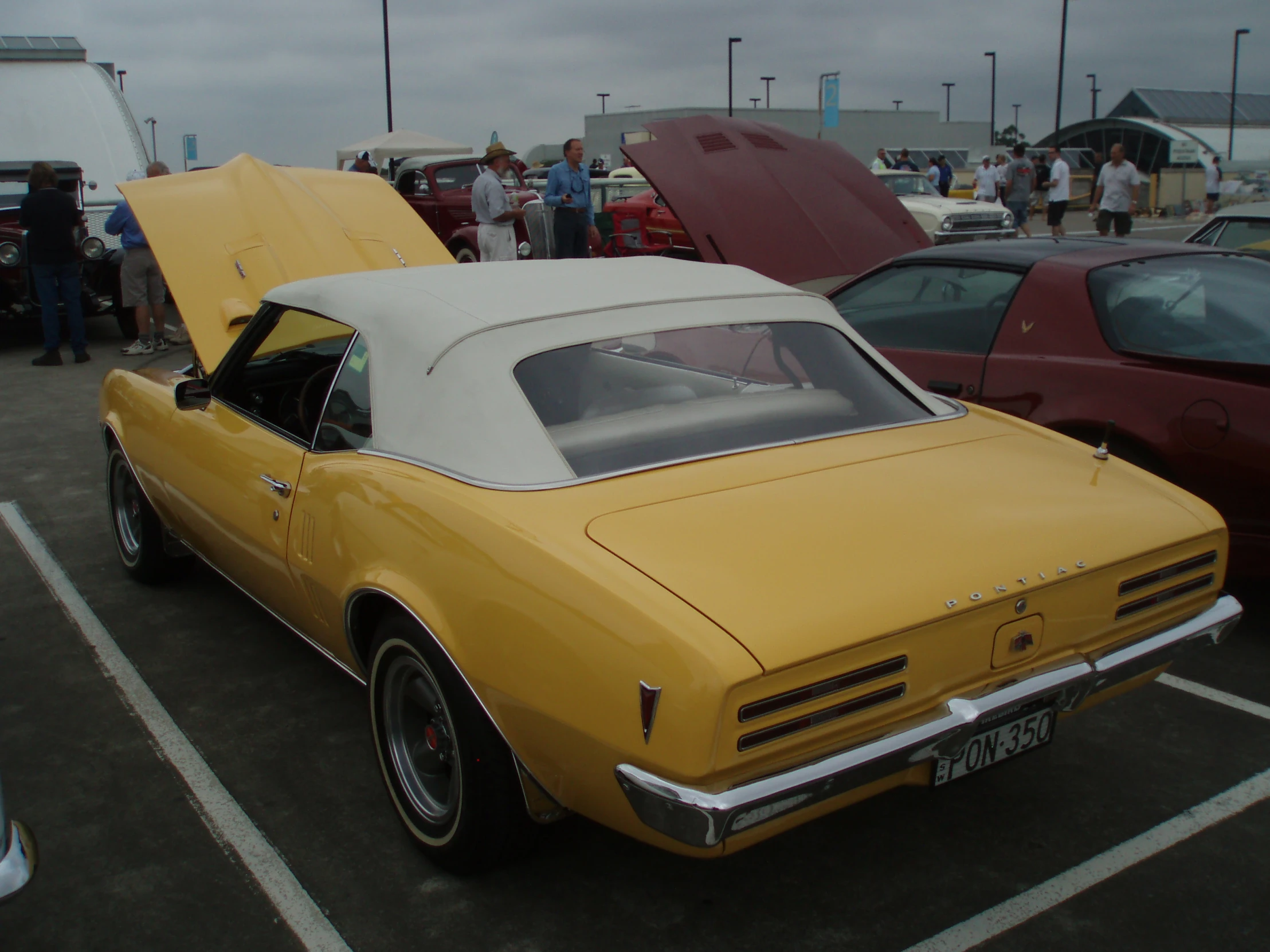 the classic car has an open hood on it's roof