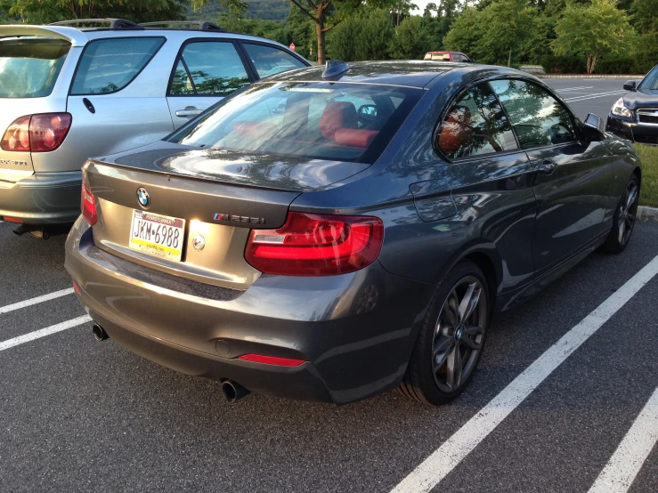 a bmw car is parked in a parking lot