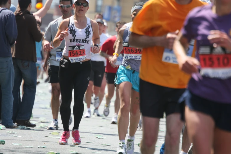 a man running a marathon with a woman on his back