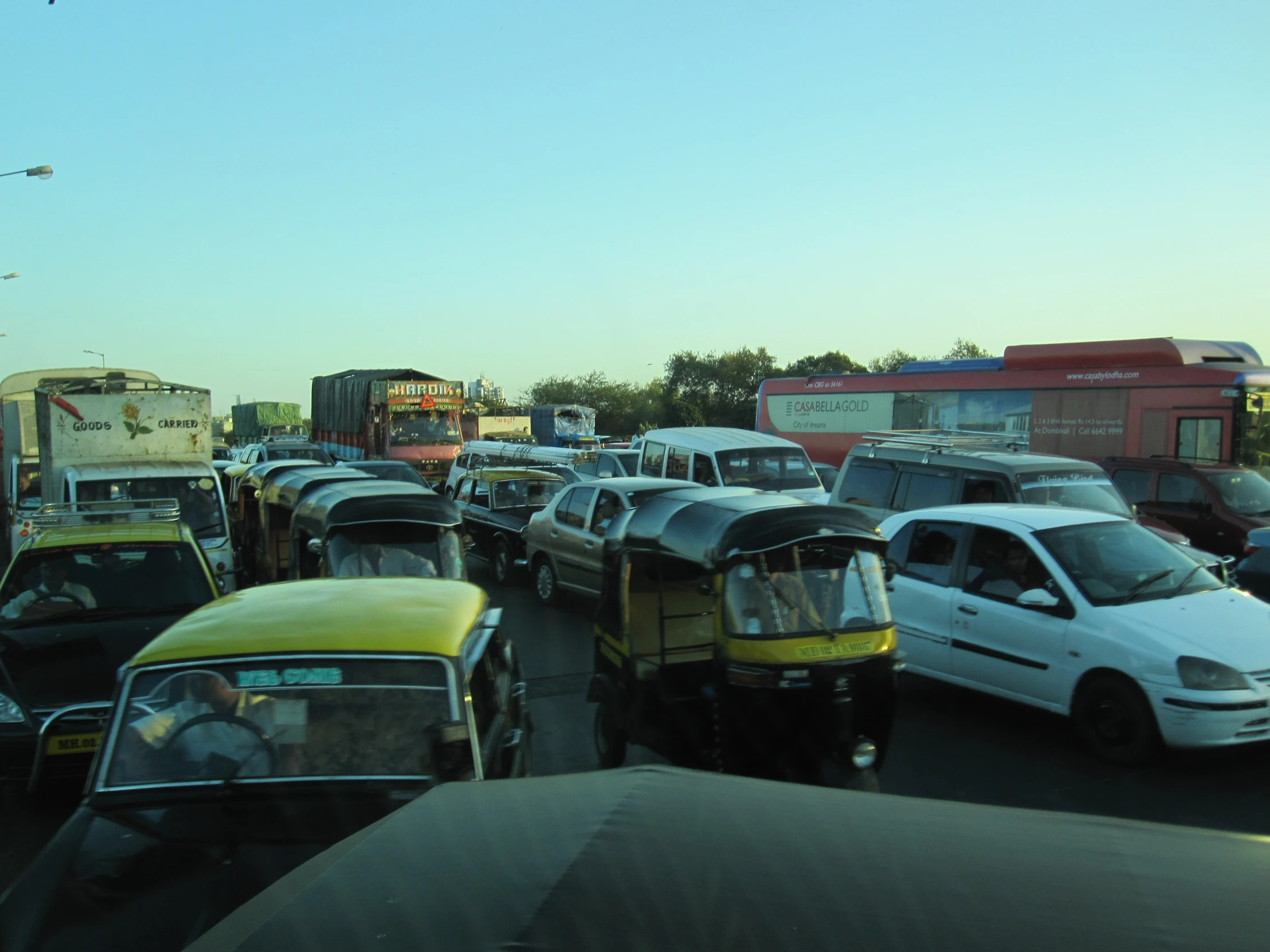 a busy street filled with lots of cars and trucks