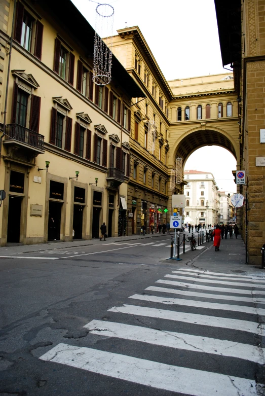 a city street lined with people and traffic lights