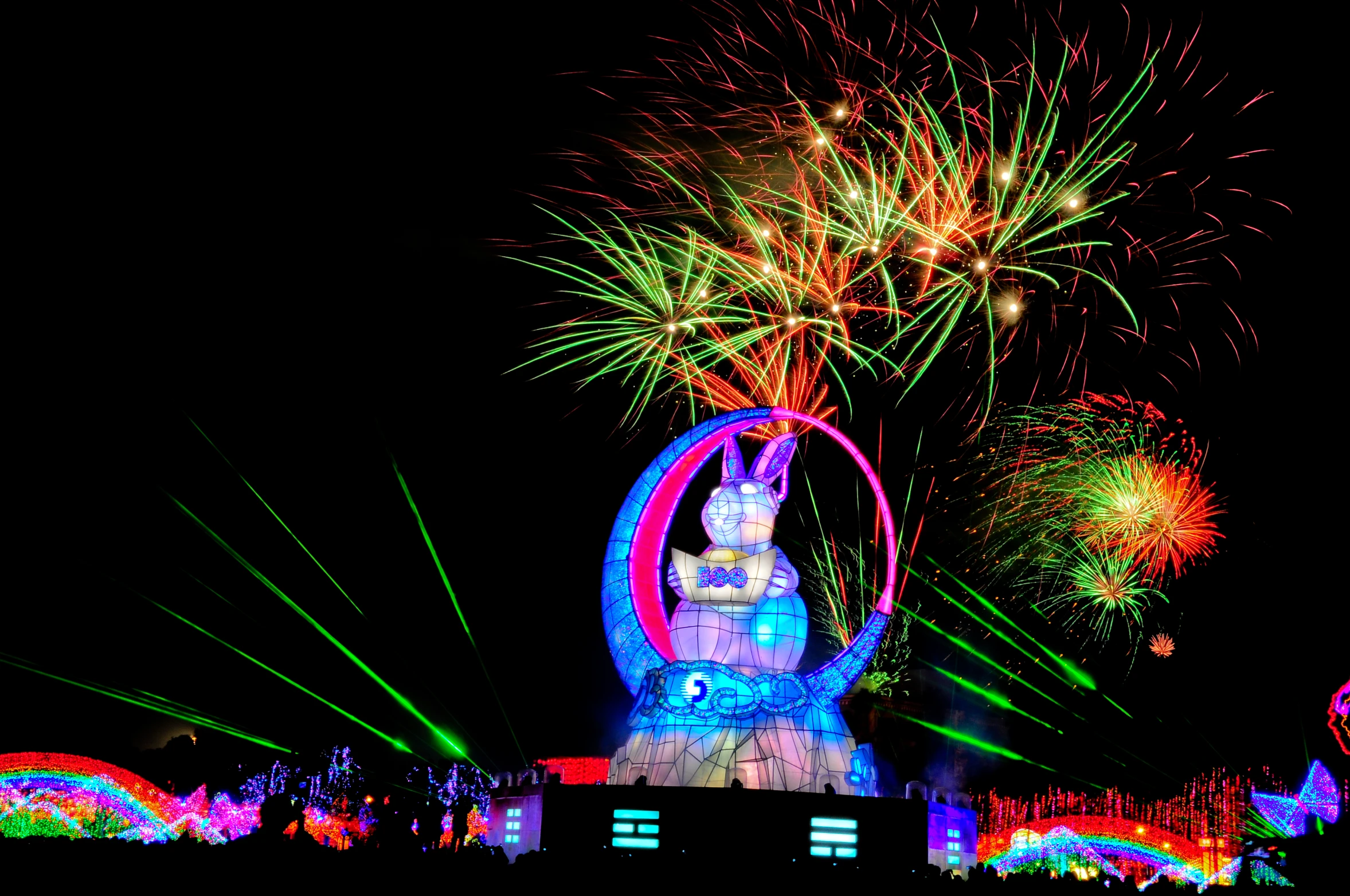 brightly lit fireworks shine brightly over amut park during the night